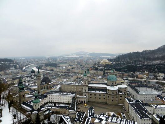 View of Salzburg from Festung Hohensalzburg. Salzburg Cathedral, with green dome, is visible in the foreground, to the right.
